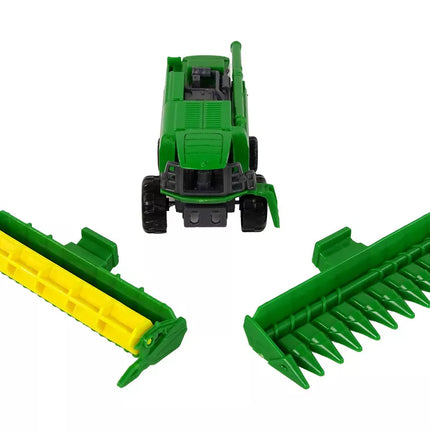 Žalias kombainas su sėjamąja