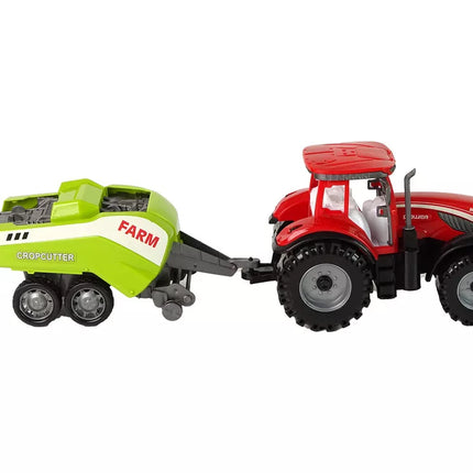 Raudonasis žemės ūkio traktorius su sėjamąja