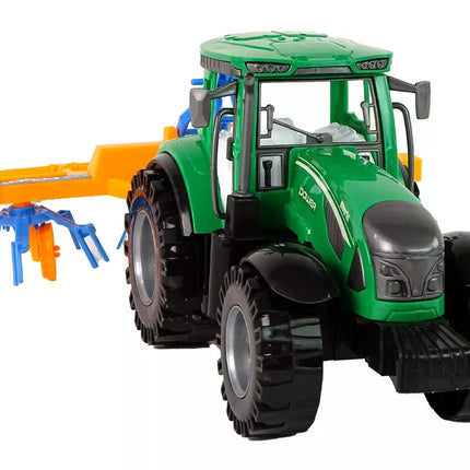 Žalios spalvos traktorius su grėbliu