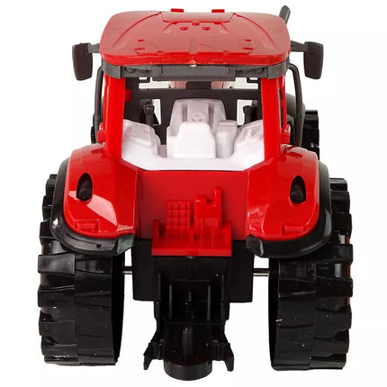 Raudonas traktorius su kultivatoriumi