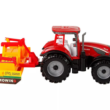 Raudonas traktorius su kultivatoriumi