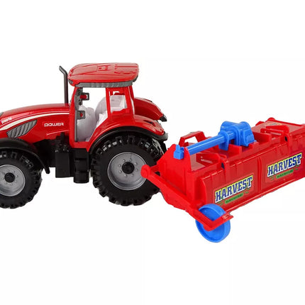 Raudonasis traktorius su plūgu