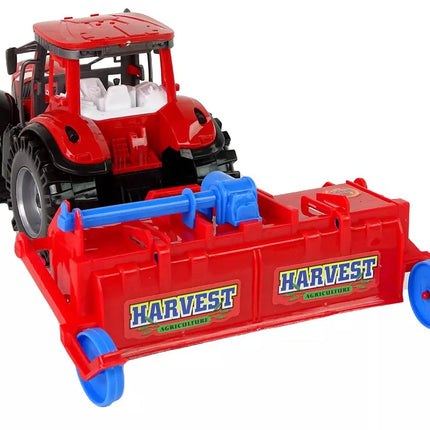 Raudonasis traktorius su plūgu