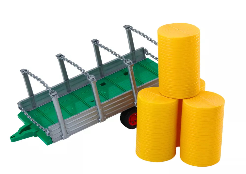 Didelis raudonas žemės ūkio traktorius su priekaba