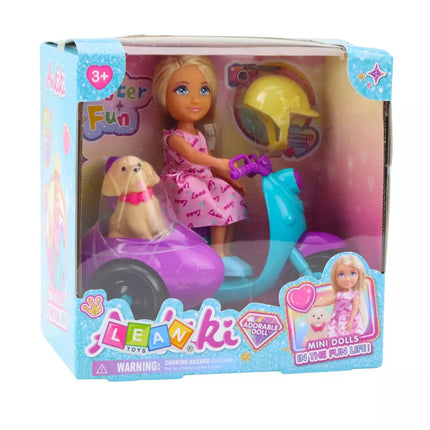 Lėlė ant triračio motorolerio su šuniuku