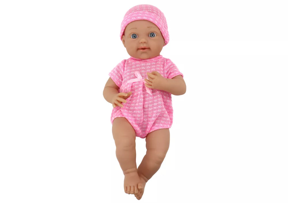 Lėlytė su rožiniais drabužiais ir čiulptuku