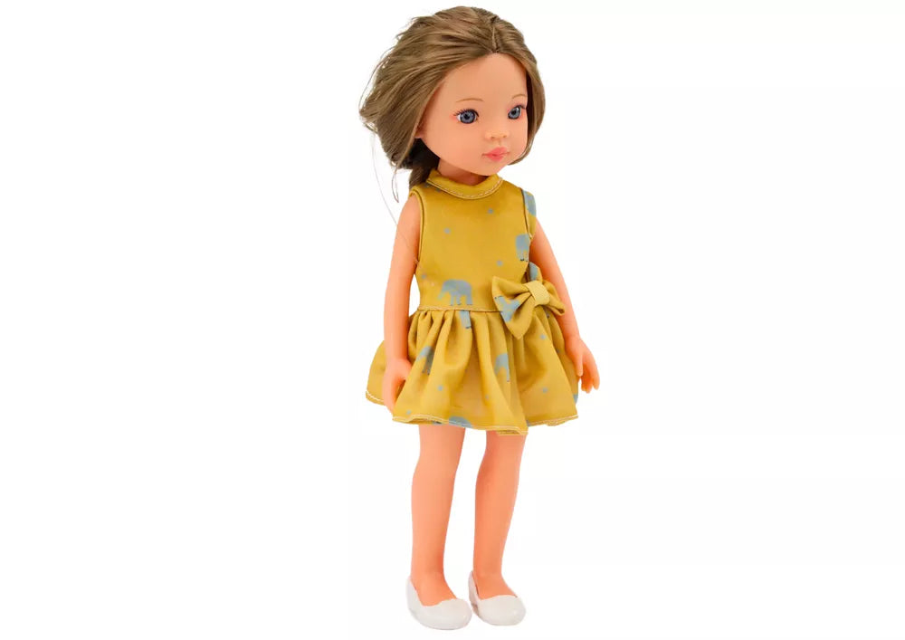 Lėlė su geltona suknele ir rudais plaukais 33 cm