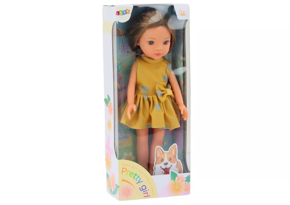 Lėlė su geltona suknele ir rudais plaukais 33 cm