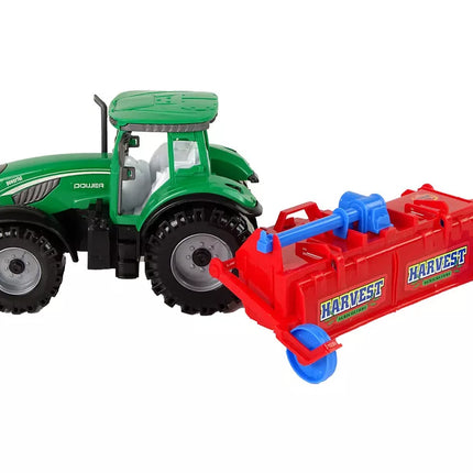 Raudonas traktorius su plūgu