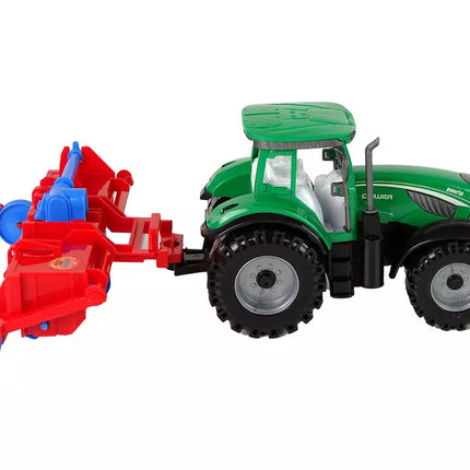 Raudonas traktorius su plūgu