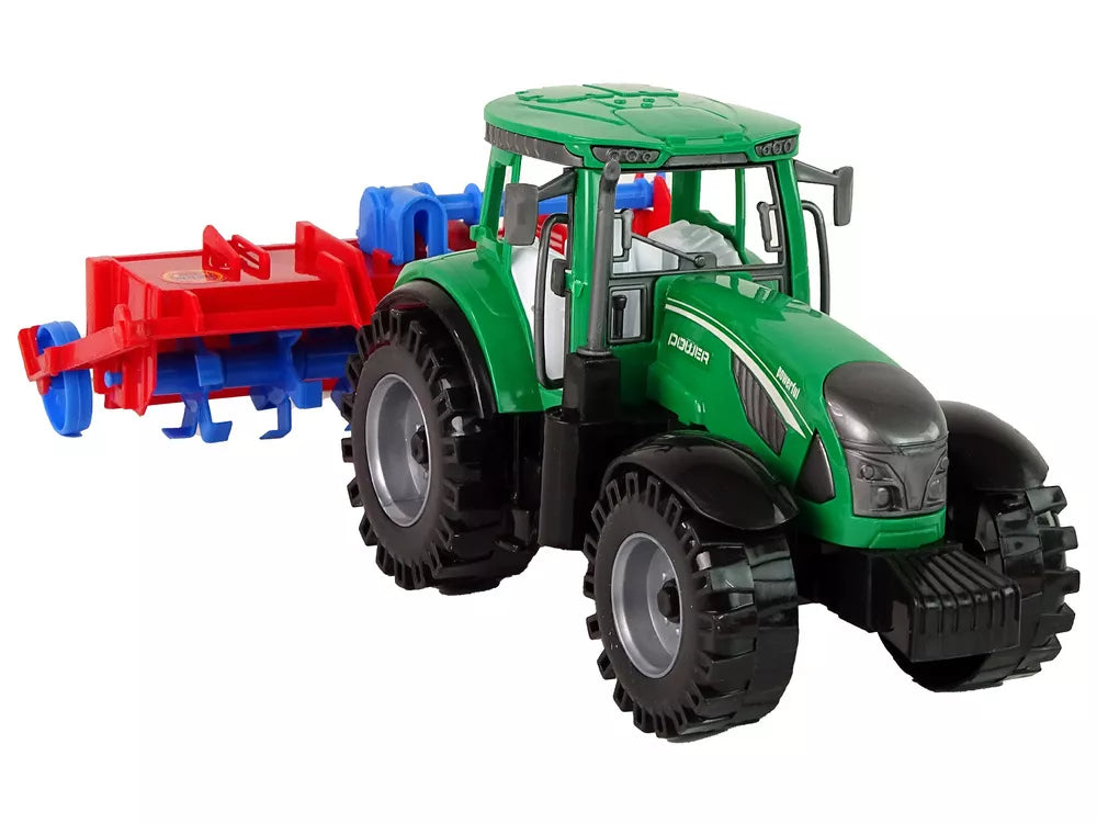 Raudonas traktorius su plūgu