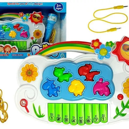 Baltas elektroninis fortepijonas su mėlynu mikrofonu