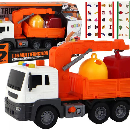 Oranžinė šiukšliavežė su kranu