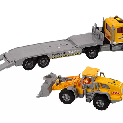 Geltonas sunkvežimis su ekskavatoriumi