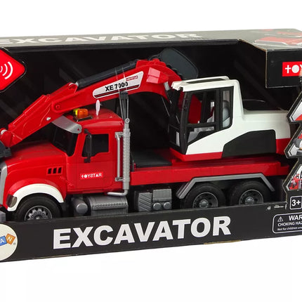 Raudonas sunkvežimis su ekskavatoriumi