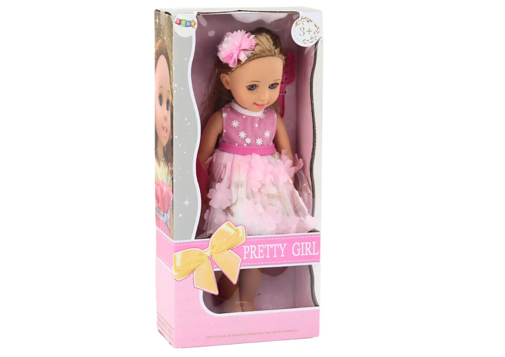 Lėlė su rožine suknele, ilgais plaukais, segtuku ir šukomis – 38 cm