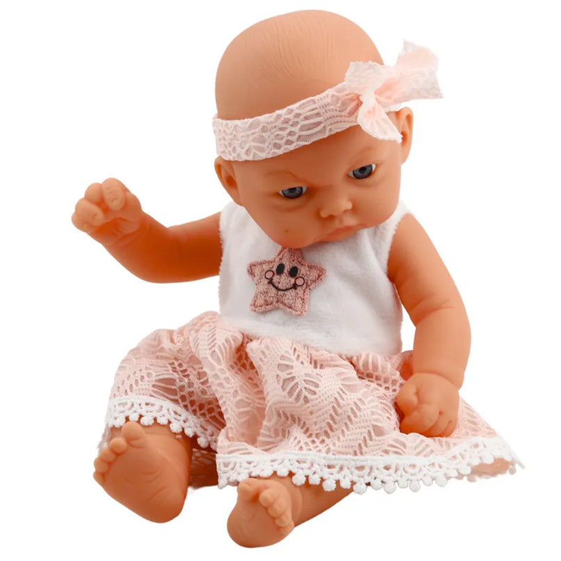 Mieganti kūdikio lėlė rožine suknele 24 cm