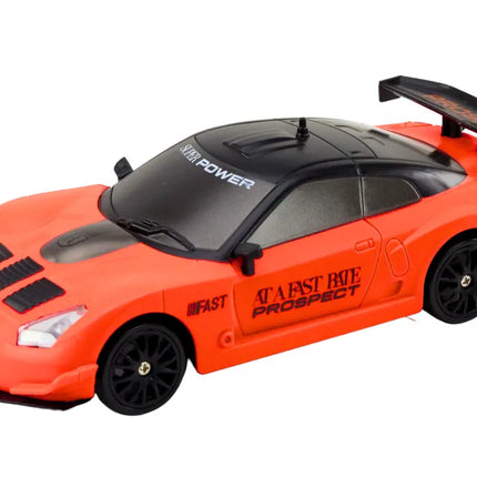 Oranžinis R/C sportinis automobilis 1:24