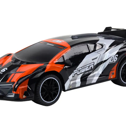R/C sportinis automobilis 1:10 – pilkas ir oranžinis, iki 25 km/val.