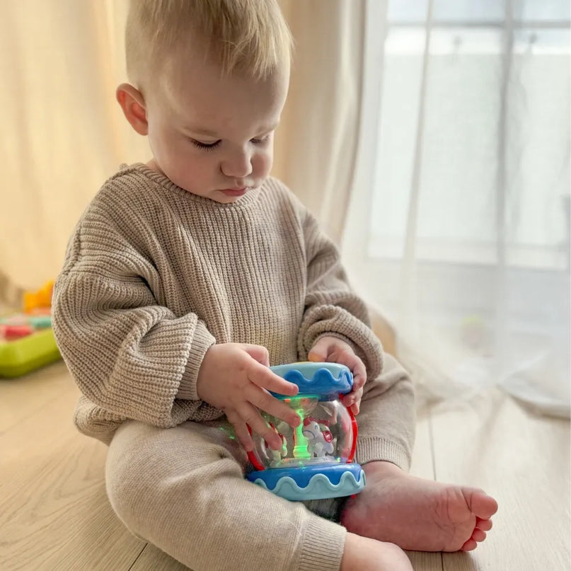 Woopie Baby muzikinis būgnelis 3in1 su žvaigždžių projektoriumi