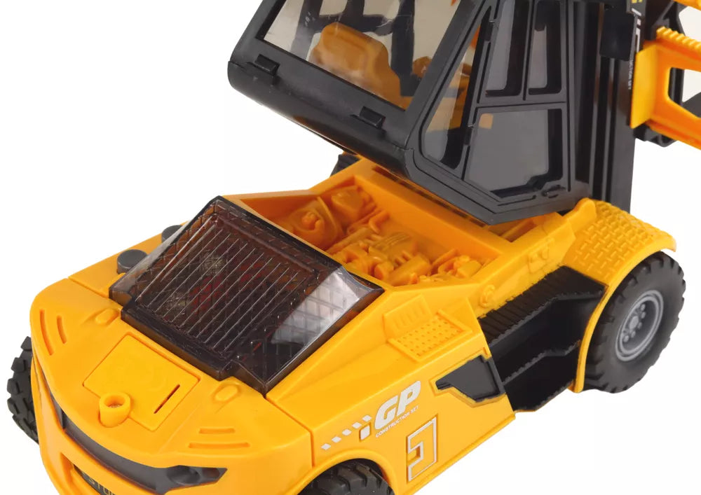 Geltonas šakinis krautuvas su kroviniu